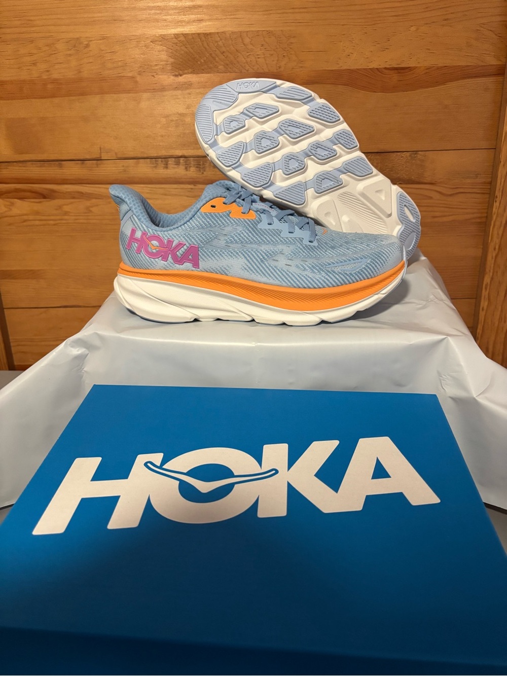 Hoka Women's Light Blue Running Sneakers with Orange Trim and Pink Logo